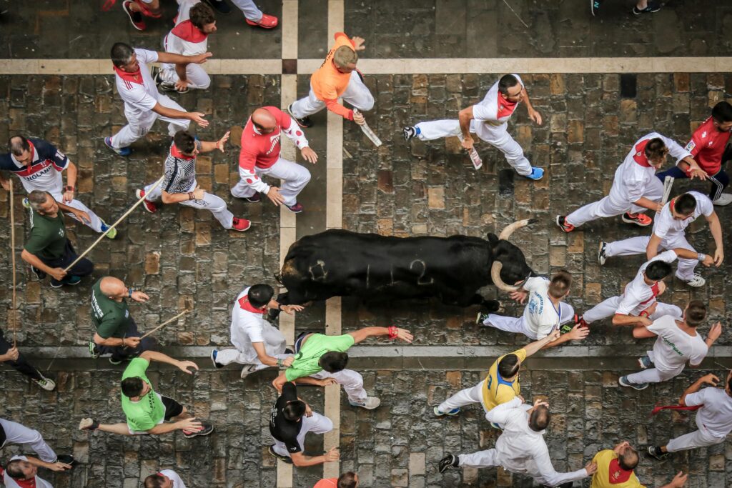 Runners trying to keep pace with the bulls during the encierro