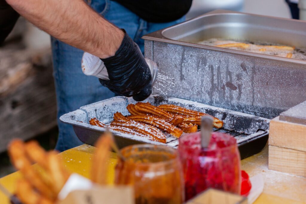 Churros frying in hot oil at La Mañueta churrería Pamplona San Fermín