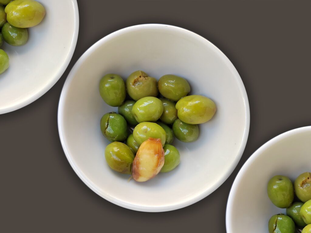 Bowl of green aceitunas with garlic, a Spanish bar snack in Pamplona