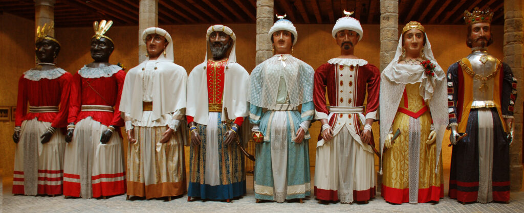 Gigantes and cabezudos figures during a San Fermin parade in Pamplona