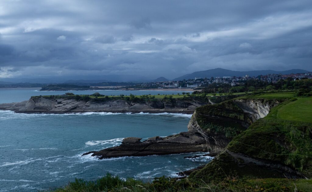 Dramatic cliff coastline of Santander, Cantabria, under a moody sky