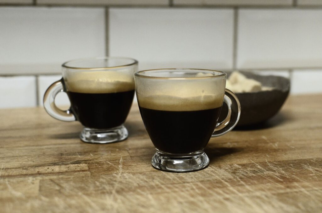 Two glasses of espresso coffee, the base of a Spanish carajillo drink