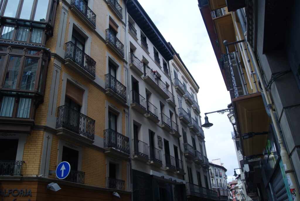 Calle Calceteros in Pamplona's Casco Viejo, the old town where San Fermín's peña clubhouses cluster