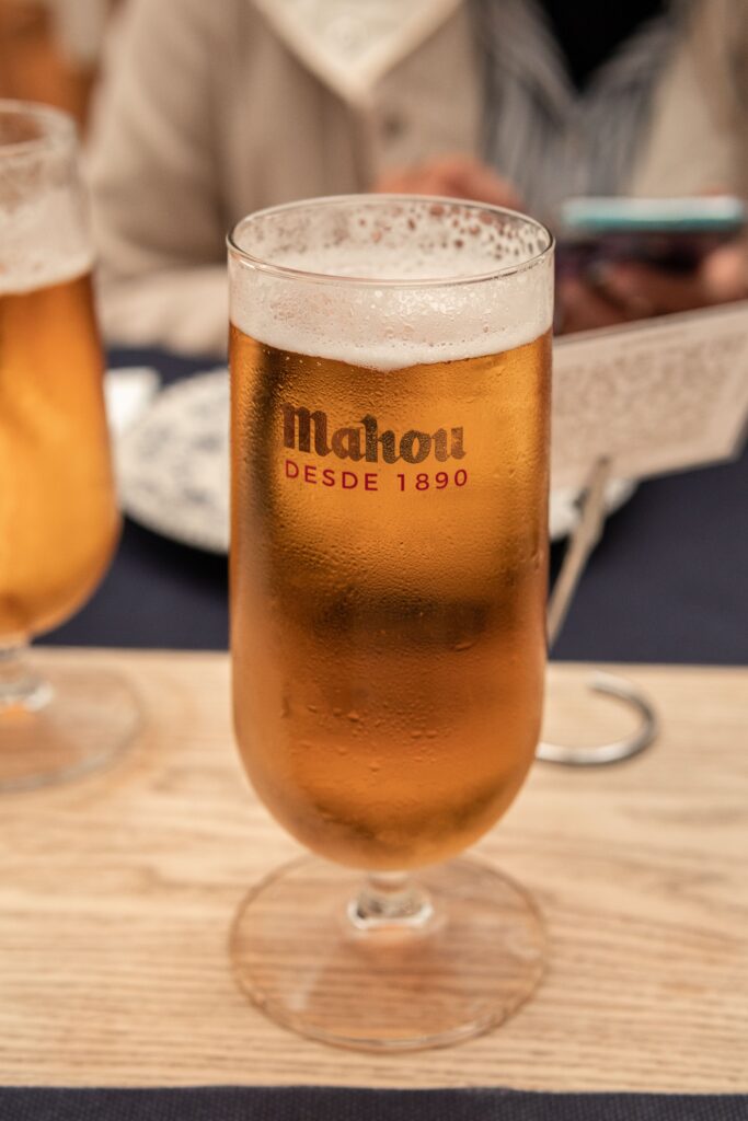 Glass of Spanish beer on a terrace table, base for a clara beer shandy