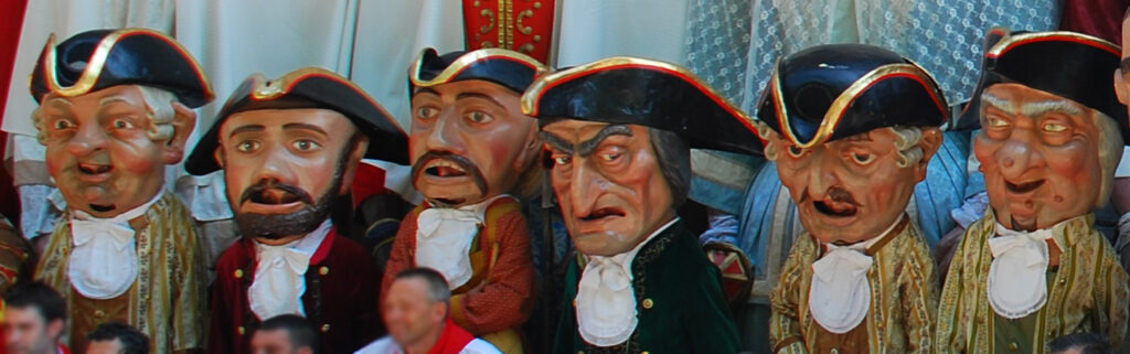 The six kilikis san fermin pamplona figures, in tricorn hats with foam rods