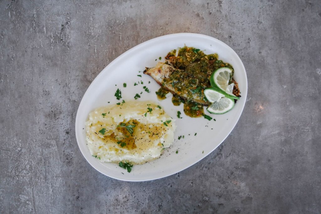 White fish in garlic green sauce, the classic presentation style for Basque kokotxas