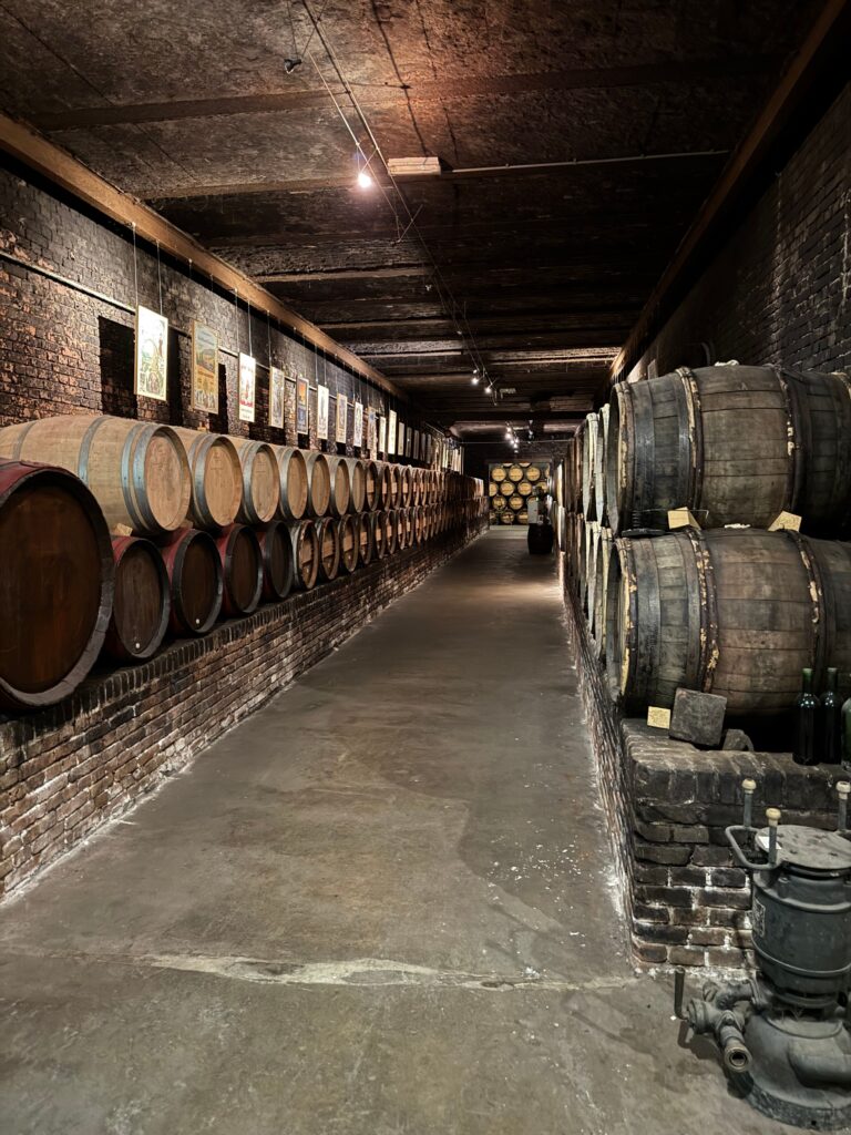 Oak wine barrels aging in a traditional Rioja cellar, Haro, Spain