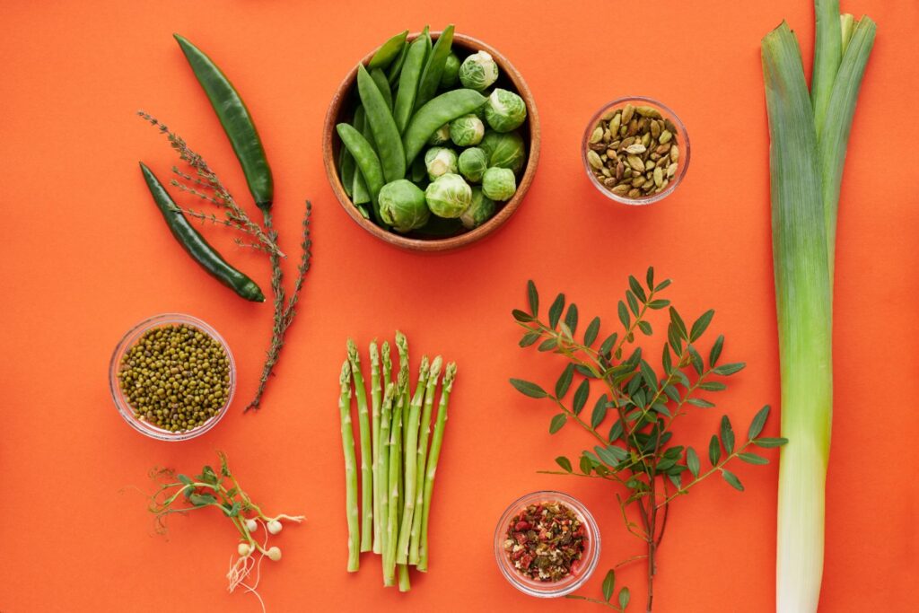 Fresh spring vegetables for menestra navarra: artichoke, asparagus, and peas