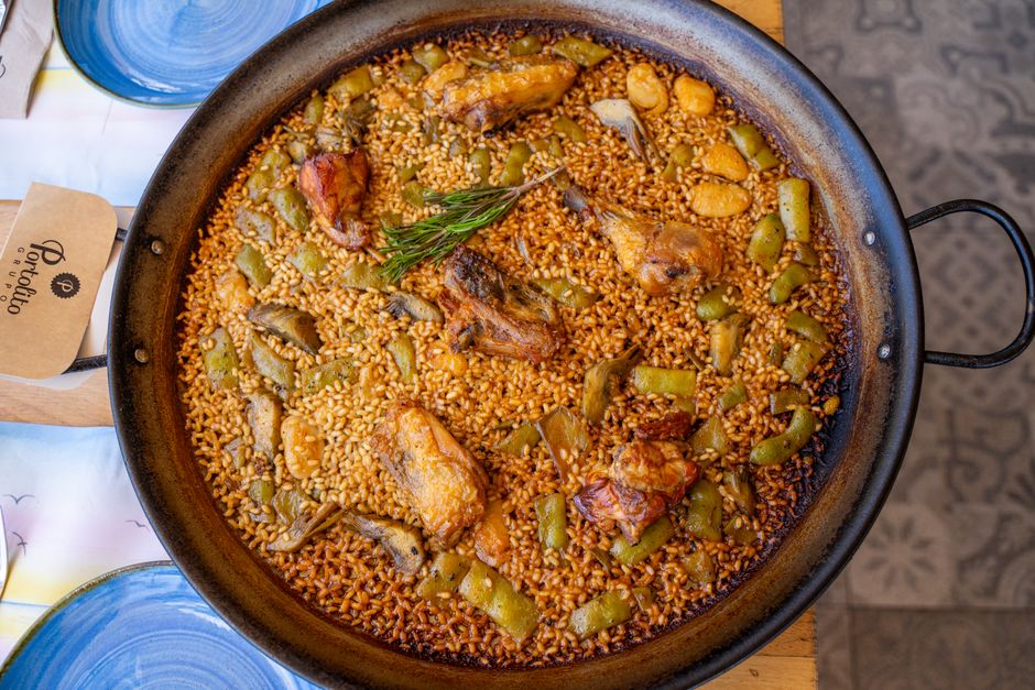 Paella valenciana with saffron rice and chicken, the Valencian dish not native to Pamplona