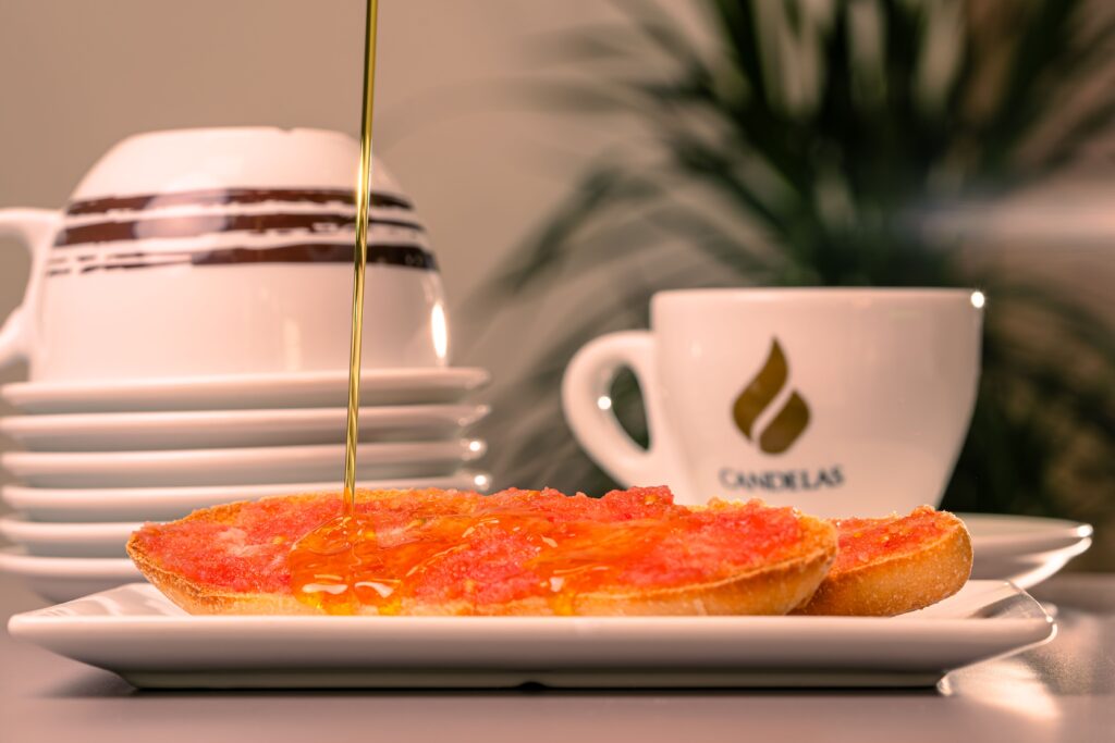Tomato toast drizzled with olive oil, a pan con tomate breakfast in Spain
