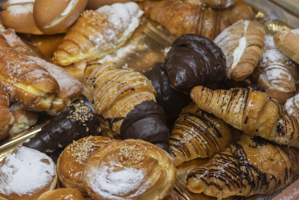 Assorted Spanish pastries in a bakery display case, postres navarros tradition