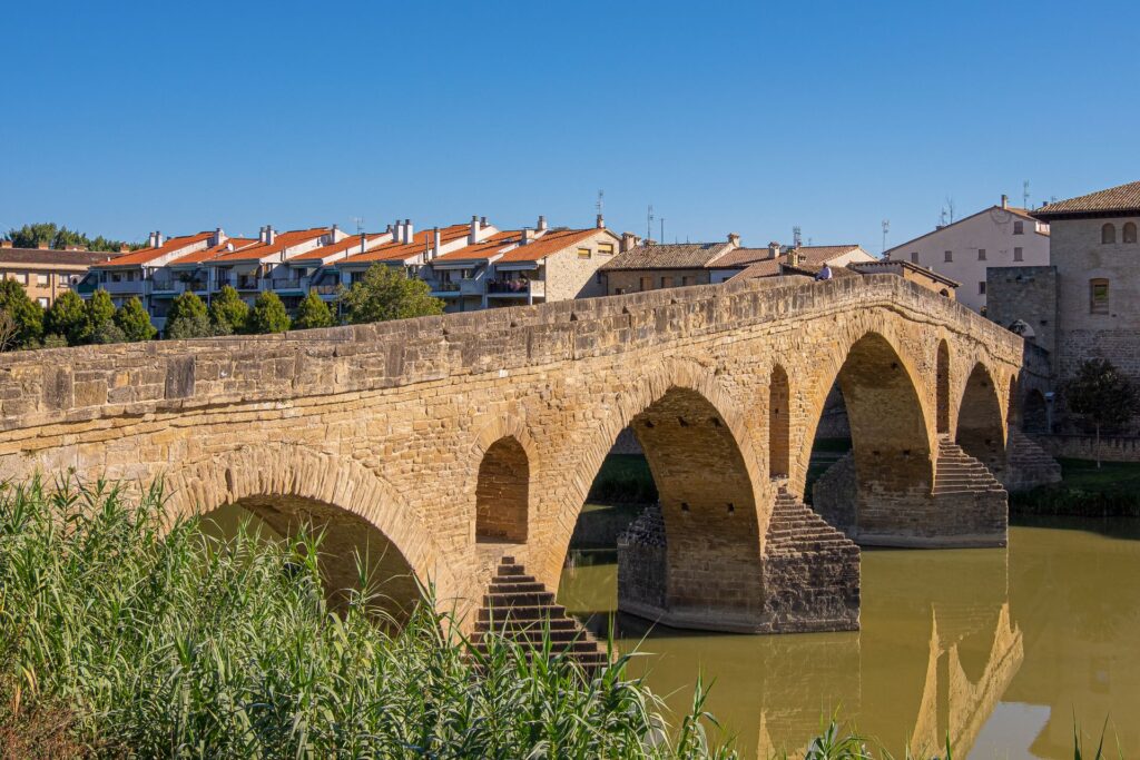 Romanesque bridge of Puente la Reina arching over the Rio Arga on the Camino in Navarra