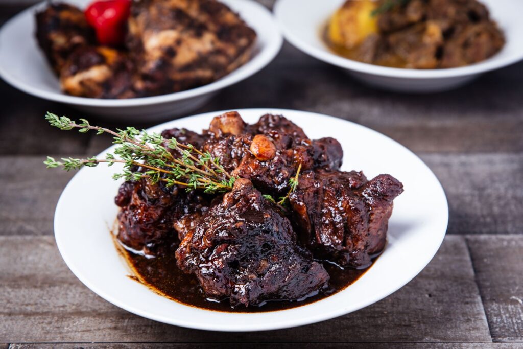 Braised rabo de toro bull tail stew served with herbs and rich wine sauce at a Pamplona restaurant