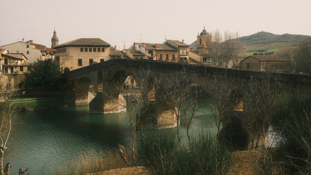 Historic stone arch bridge over the Rio Arga in Navarra, Spain