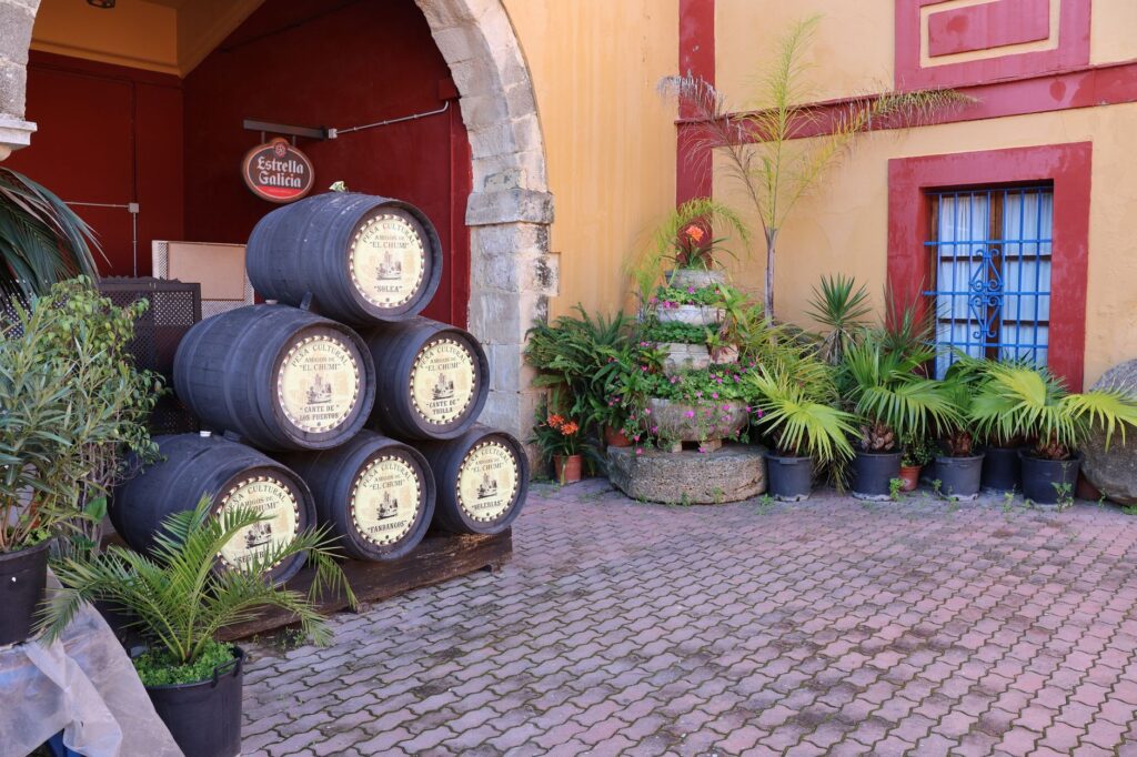 Stacked sherry aging barrels in a courtyard, El Puerto de Santa Maria, Jerez