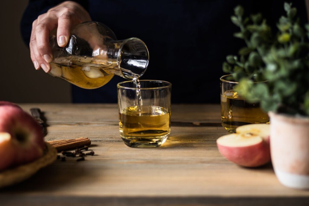Asturian cider poured from height in the traditional escanciado style, Spain