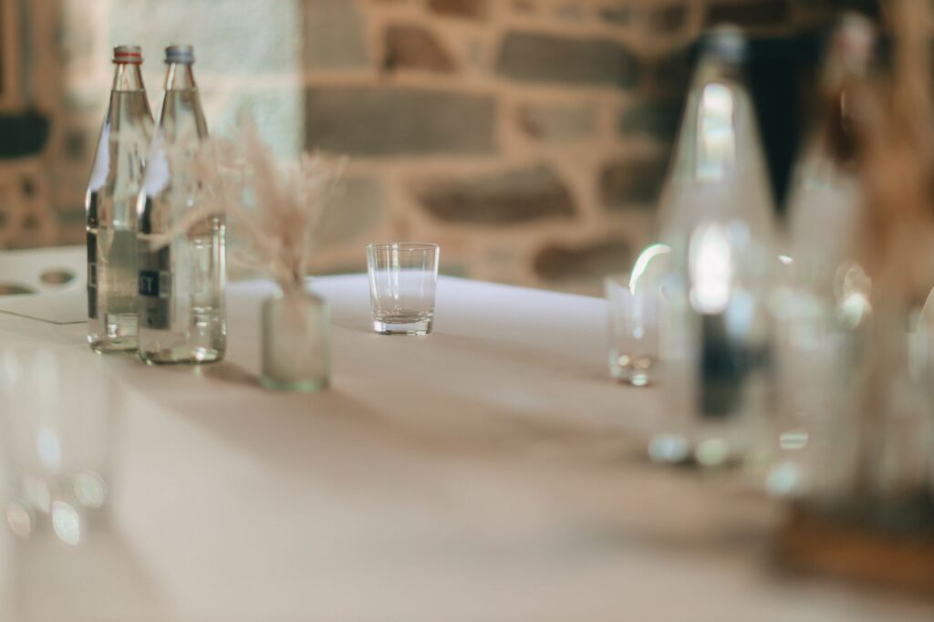 Chilled glass mineral water bottles on a restaurant table, Spain
