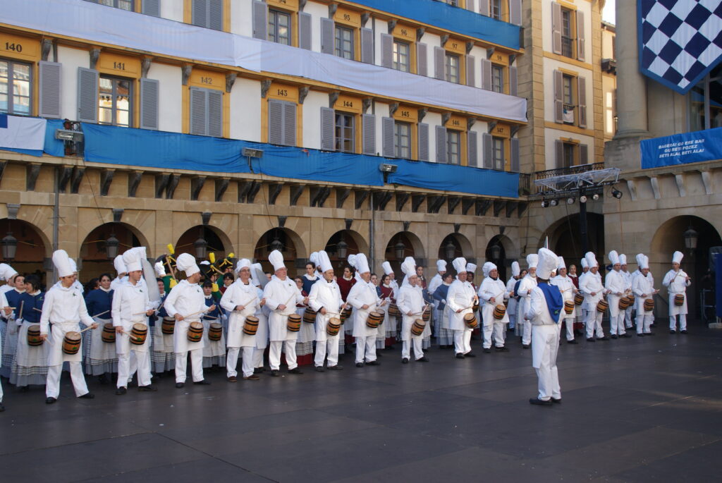 Tamborrada drummers dressed as cooks in Plaza de la Constitución, San Sebastián