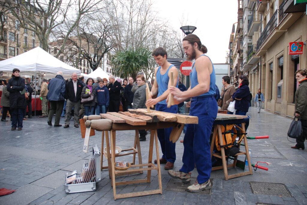Two txalapartaris playing the txalaparta, the traditional Basque wooden percussion instrument