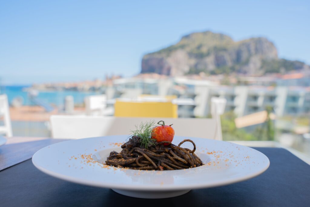 Black squid-ink pasta with calamari rings, the ink base behind txipirones en su tinta
