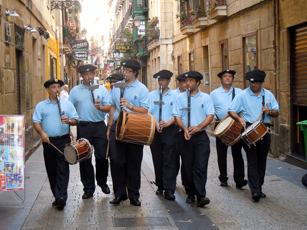 Txistulari band playing txistu flutes, Basque street procession
