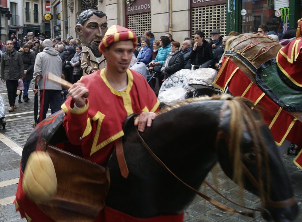 Zaldiko horse figure and kiliki marching in the San Fermin comparsa, Pamplona